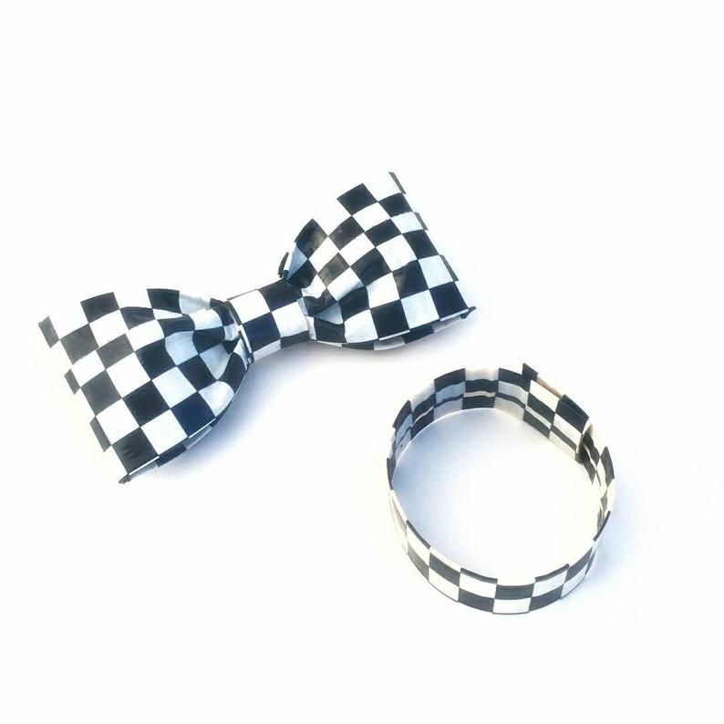 Black and white checkered print bow tie with matching wristband
