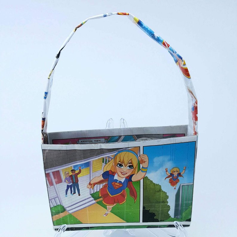 Small white tote bag created with an upcycled DC Superheros Girls comic book featuring Supergirl. 