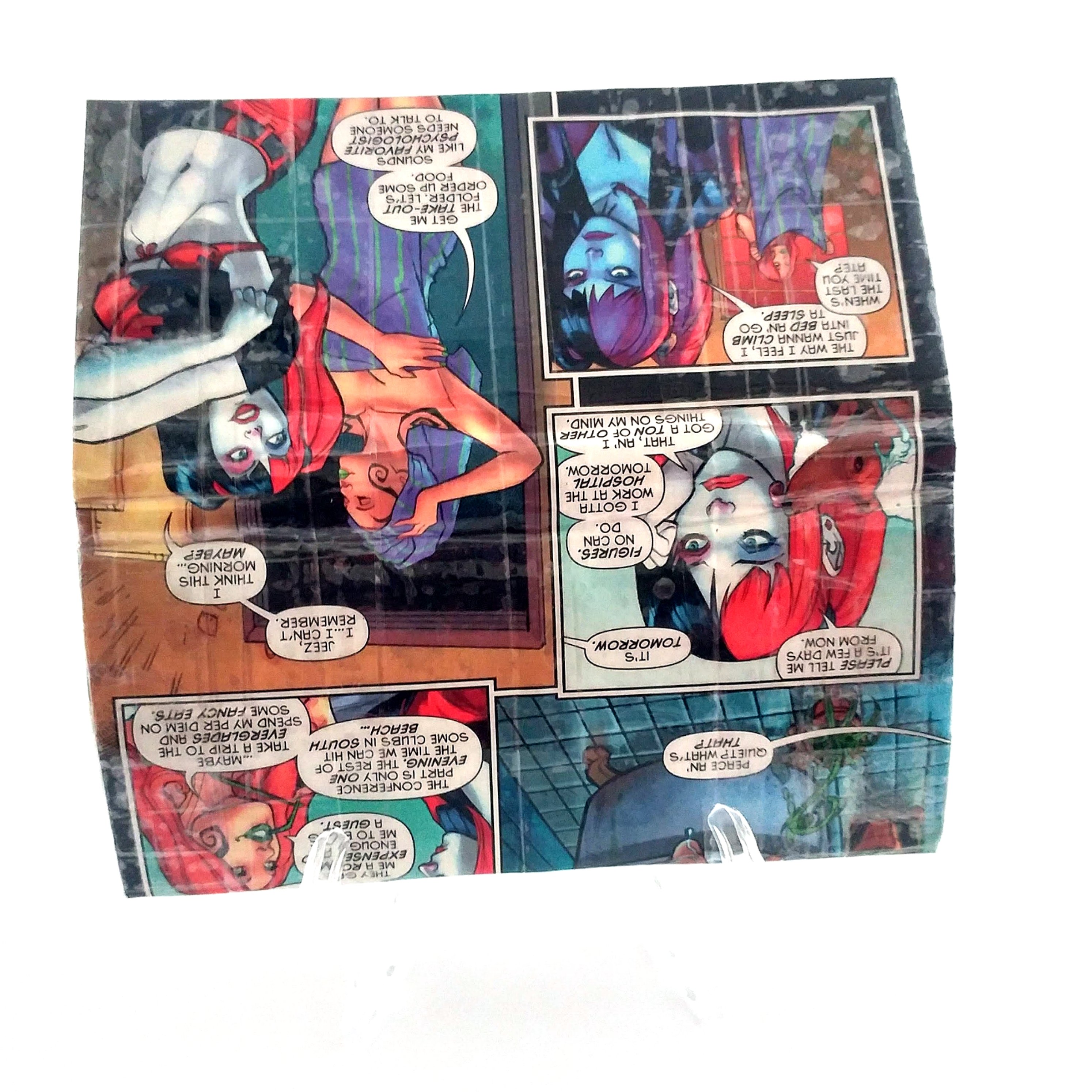 Showing Harley Quinn and best friend Poison Ivy showering on a handmade wallet create from an upcycled Harley Quinn comic book.
