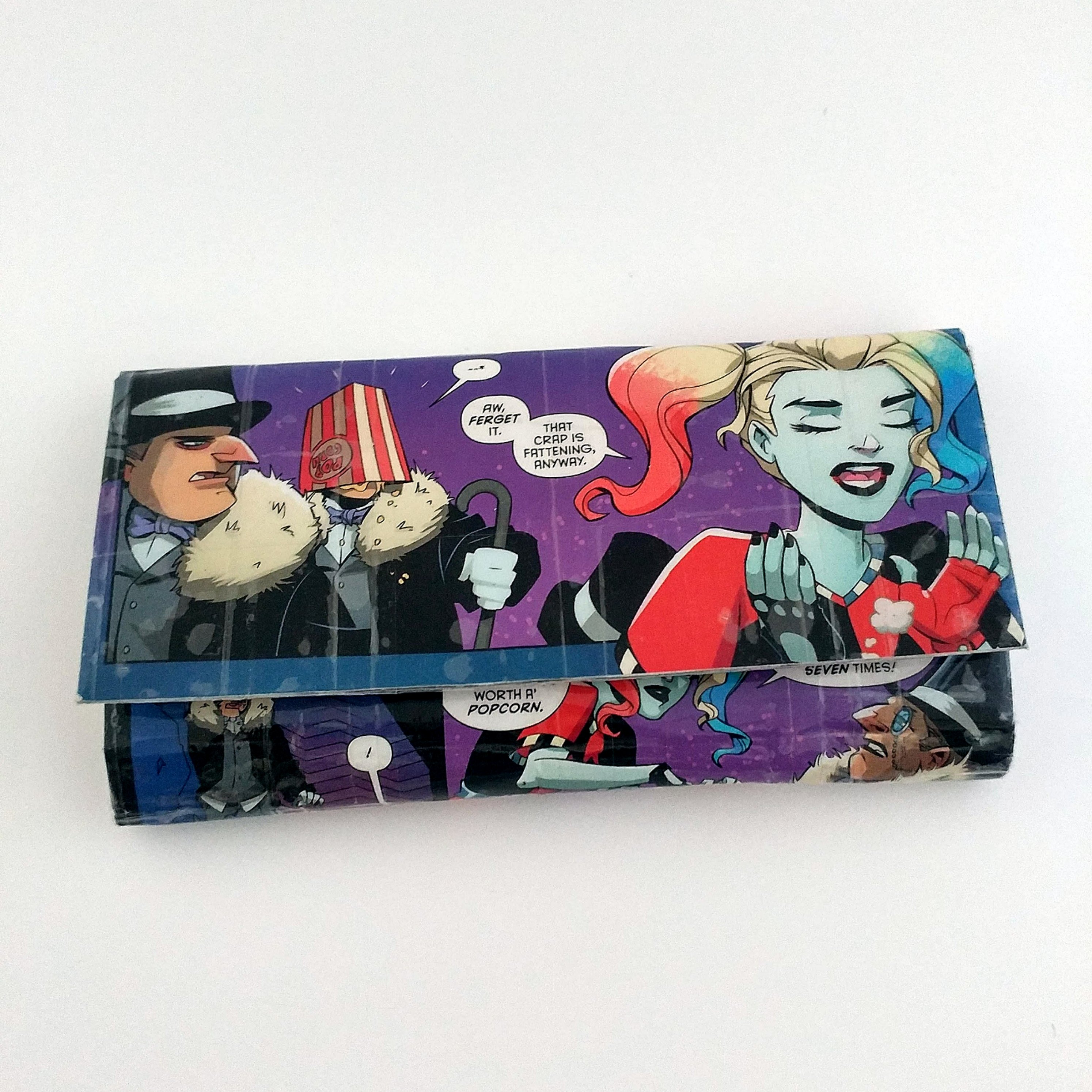 Showing Harley Quinn going to the movies on a handmade wallet create from an upcycled Harley Quinn comic book.