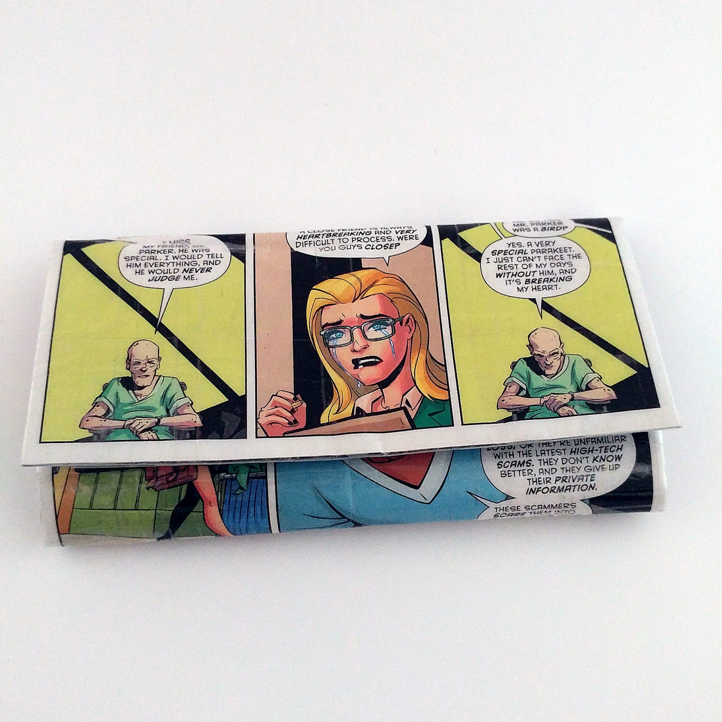 Dr. Harleen Quinzel aka Harley Quinn on the front of a long clutch style women's wallet made from a Harley Quinn comic book. 