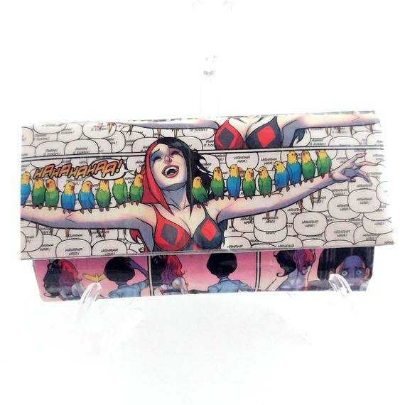 Showing Harley Quinn with birds on a handmade wallet create from an upcycled Harley Quinn comic book.